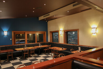 Empty Booth Seating and Tables in a Restaurant Dining Room