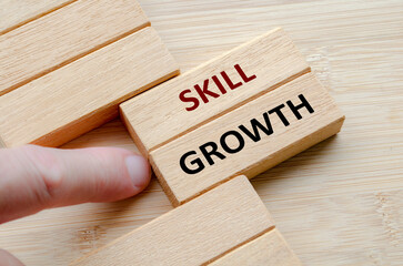 SKILL GROWTH text on wooden blocks, Structured plans that promote long-term skill growth and...