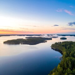 Aerial view of serene lake landscape at sunset in Finland with islands