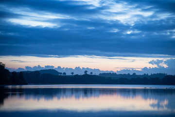 Tranquil Blue Hour Over Schwentine River near Plöner See in Schleswig-Holstein, Germany - Horizontal Format
