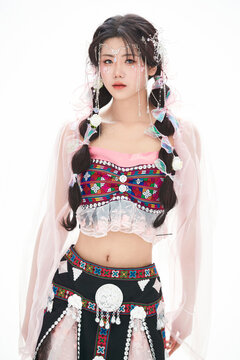 An Eastern girl dressed in the traditional costume of the Hani ethnic minority, which is popular among online influencers.