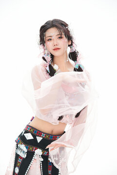 An Eastern girl dressed in the traditional costume of the Hani ethnic minority, which is popular among online influencers.