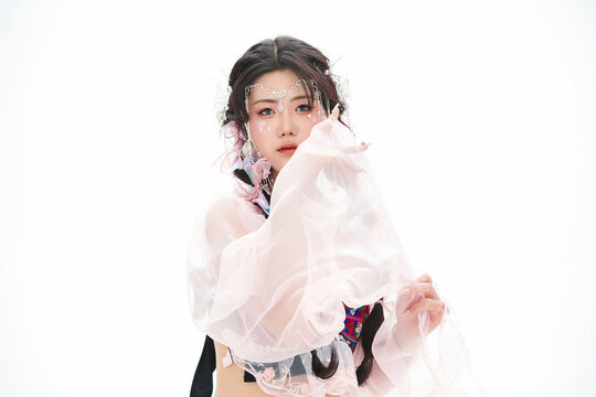 An Eastern girl dressed in the traditional costume of the Hani ethnic minority, which is popular among online influencers.
