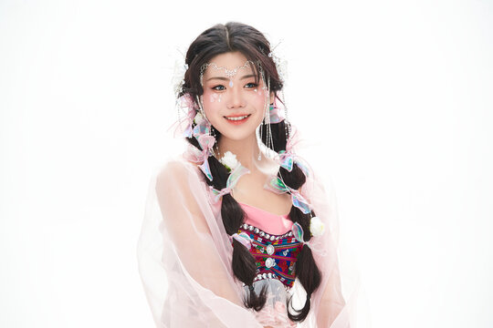 An Eastern girl dressed in the traditional costume of the Hani ethnic minority, which is popular among online influencers.