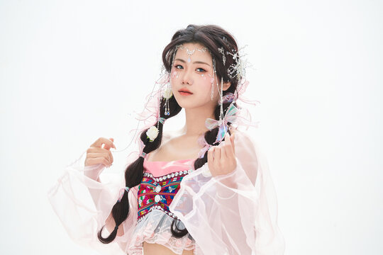 An Eastern girl dressed in the traditional costume of the Hani ethnic minority, which is popular among online influencers.