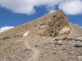 Mettelhorn, Switzerland - August 24th 2024: The last metres on the hike to the summit through rocky...