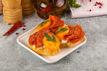 Bruschetta with sausage and tomato