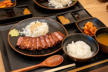 Gyukatsu or beef cutlet. A traditional Japanese food that consists of a deep-fried beef cutlet. served with vegetable