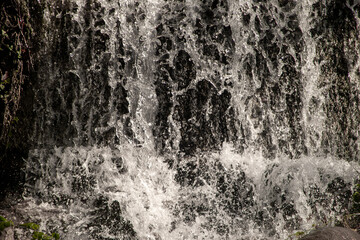 Small waterfall  with fast flowing water. Freeze scene.