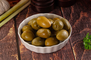 Greek green olives marinated in the bowl