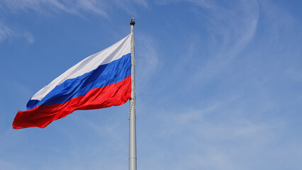 Russian flag. Russian flag fluttering in the wind. High quality photo.