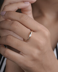 Gold Diamond engagement ring for women and girls lifestyle image with model hand 