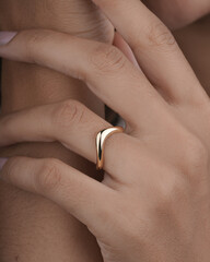 Gold Diamond engagement ring for women and girls lifestyle image with model hand 