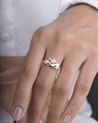 Gold Diamond engagement ring for women and girls lifestyle image with model hand 