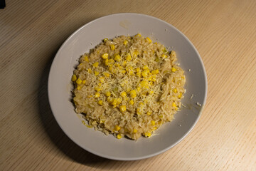 A plate of corn cheese risotto.