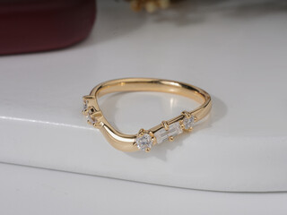 Gold Diamond engagemenet ring for women isolated in white podium 