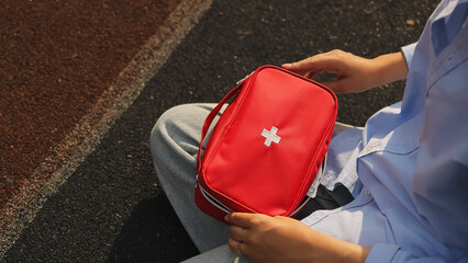 first aid kit. First aid kit. Woman and first aid kit.High quality photo