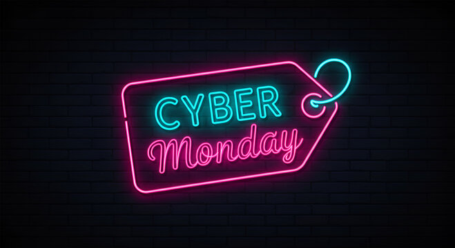 Neon pink and teal Cyber Monday sale tag against a dark brick background.