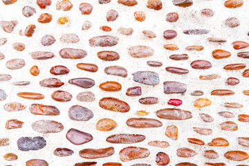 Top view. The surface of the convex round stone is brown and salient. For floor and background.