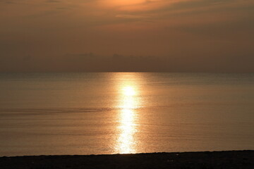 Sunrise over the sea, morning clouds