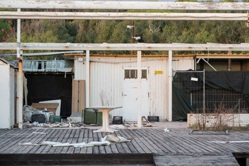 An old abandoned seaside facility on the coast of Paestum, Italy, showing signs of decay and...