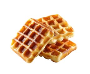 Golden brown waffles stacked on a plate for breakfast enjoyment