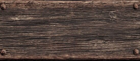 Naklejka premium Aged, weathered wooden plank with visible grain and fasteners