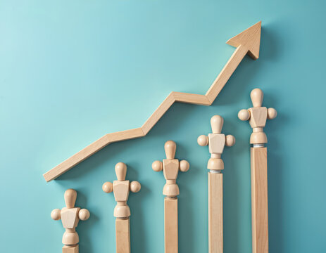 Wooden figures lined up in ascending order beneath upward trending arrow graph. Team development, collective growth, organizational success strategies. Visualizing employee empowerment for career