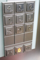 Elevator control panel with Braille buttons