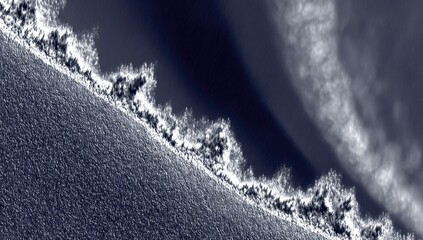 Abstract,  dark  blue-grey  surface  with  white  edged  ridge