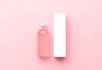 Pink Cosmetic Bottle with Box on Pastel Background