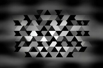 Abstract pattern of many small triangles in grayscale, creating a textured, geometric effect. Blurry edges suggest depth