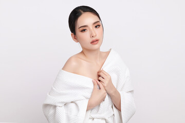 A beautiful young Asian woman with clean, fresh skin against a white background. Skincare, facial...