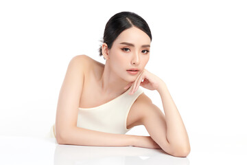 A beautiful young Asian woman with clean, fresh skin against a white background. Skincare, facial...