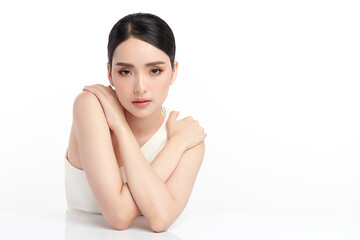 A beautiful young Asian woman with clean, fresh skin against a white background. Skincare, facial...