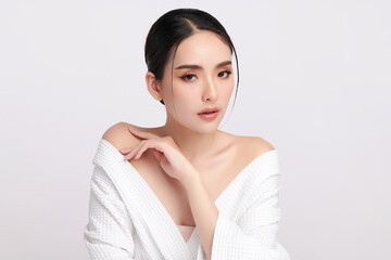 A beautiful young Asian woman with clean, fresh skin against a white background. Skincare, facial...