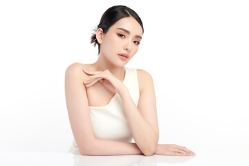 A beautiful young Asian woman with clean, fresh skin against a white background. Skincare, facial...
