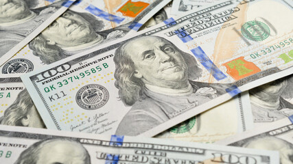 Close-up of the image of American President Benjamin Franklin on a hundred dollar bill. Set of American dollar bills.