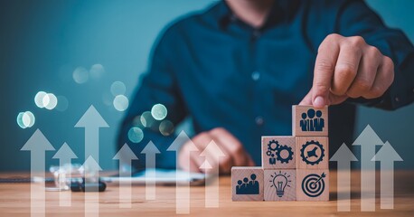 Businessman building blocks of business success with upward arrows for growth