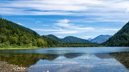 Hick lake in Sasquatch provincial park showcasing its calm waters, wooded shoreline, and campground surroundings, Harrison, BC, Canada