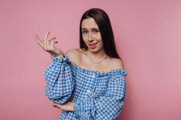 Confused Woman in Blue Checkered Dress