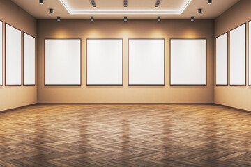 Contemporary gallery room with empty vertical poster frames on lighted walls and wooden floor,...