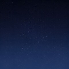 Fototapeta premium Celestial beauty of a star cluster shining brightly in the vast, dark expanse of the night sky.