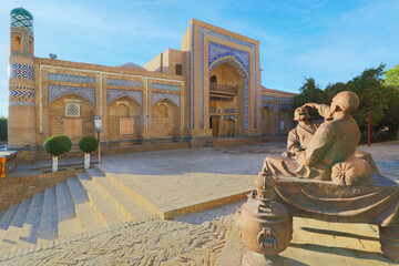 Khiva, Uzbekistan, bronze sculpture depicting a conversation between two old men in front of...