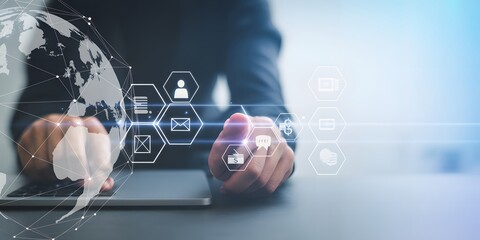 Digital Connectivity at Work: A modern professional engages with a holographic display of global digital data, symbolizing innovation, communication.