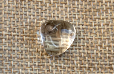 Samples of natural mineral from geological collection - rolled colorless Rock crystal gem stone on...