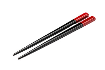 Pair of black chopsticks with red tips on a black background isolated on a transparent background image