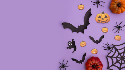 Halloween festive background design featuring orange pumpkin, ghost, black bats and spiders. 