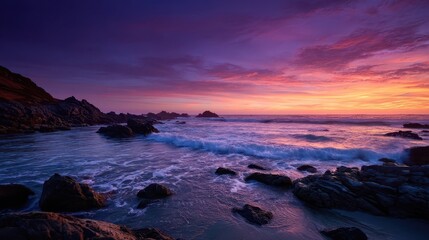 Fototapeta premium Rocky Shoreline with Tide Crashing at Vibrant Sunset Scene