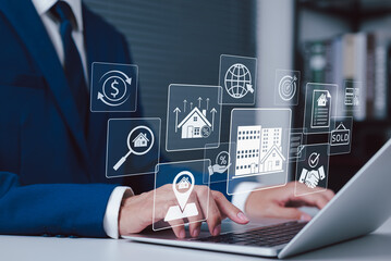 Real Estate Search and Property Investment Platform Concept. Businessman using laptop with icons for property search, investment, sales, and real estate management, buying, selling, renting properties